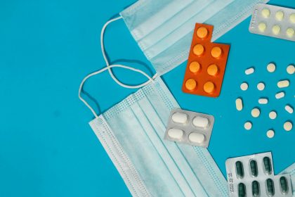 white blister pack on blue surface